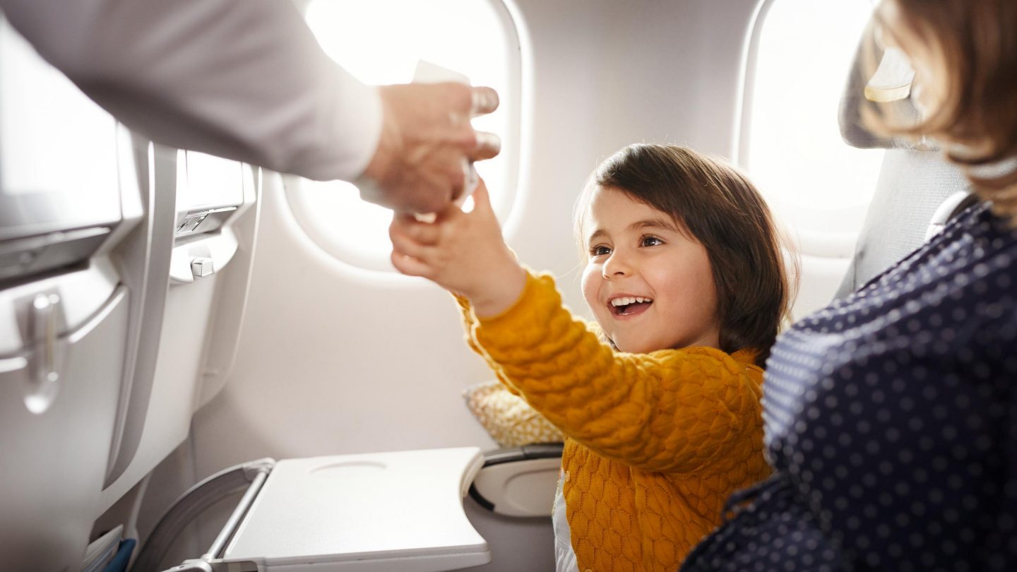 Child in Economy Class intercontinental Child getting a drink in Economy Class