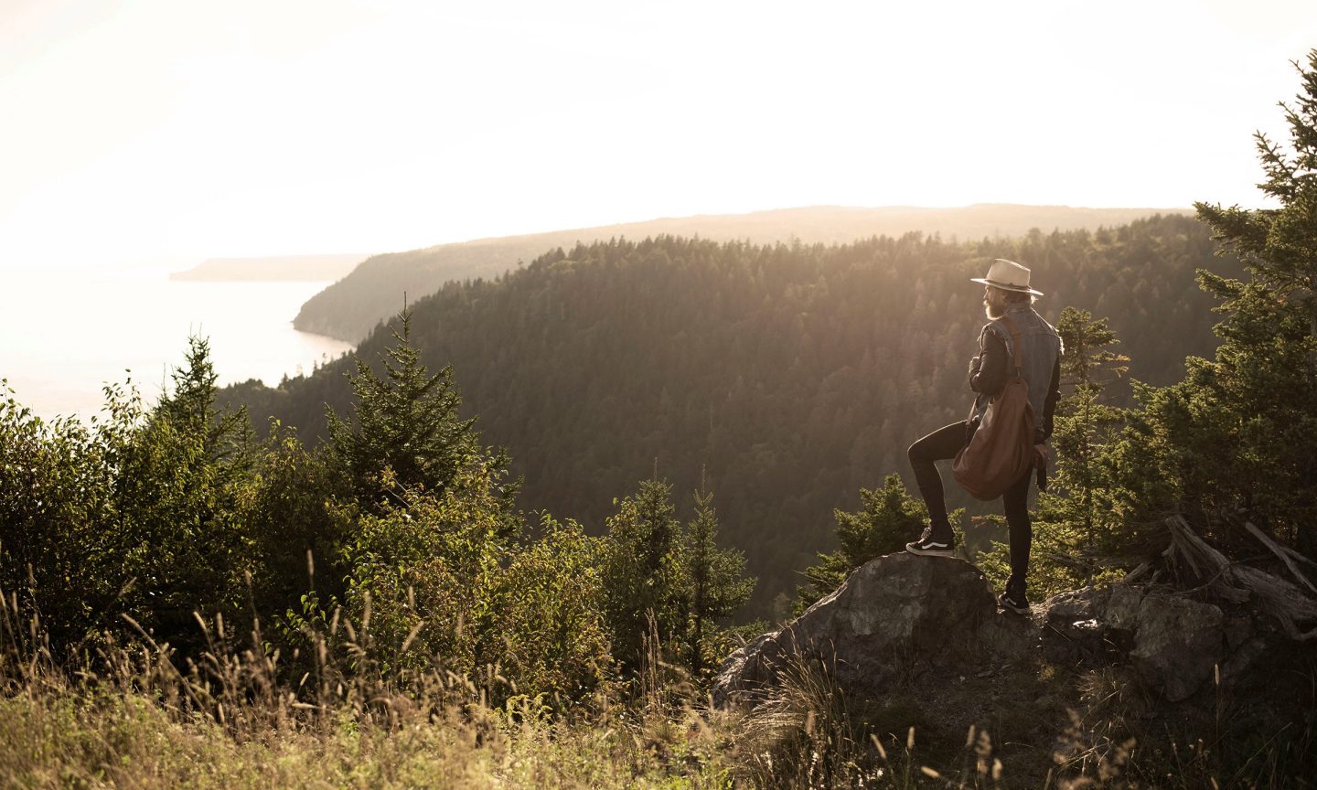 Man standing on a mountain peak