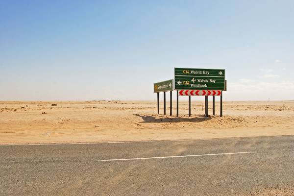 Road signs in the desert on the road to Windhoek